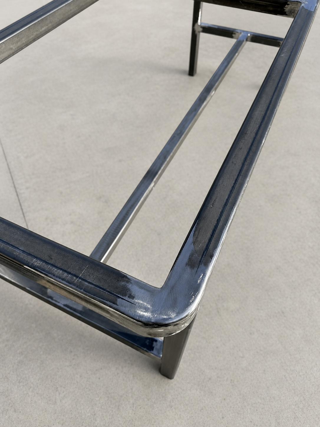 Close-up of a rounded corner on a custom steel table frame.